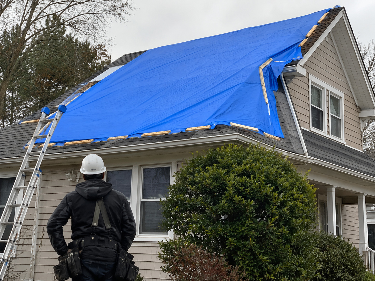 Property protected with secure roof tarp