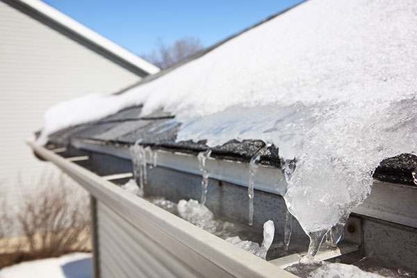 Ice-melting-into-gutter-from-ice-dam
