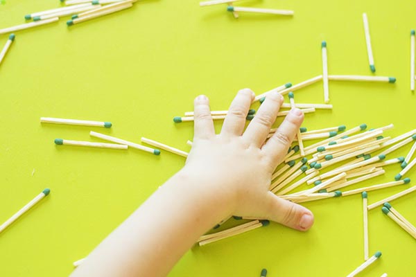child playing with matches