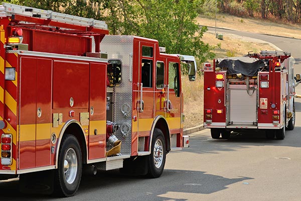 fire-trucks-on-their way to a 2 alarm fire